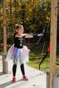 In typical Zoe style, you can't shoot a bow without a tutu.